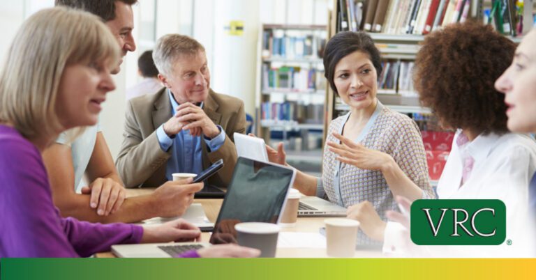 group school admins collaborating with laptops digital storage