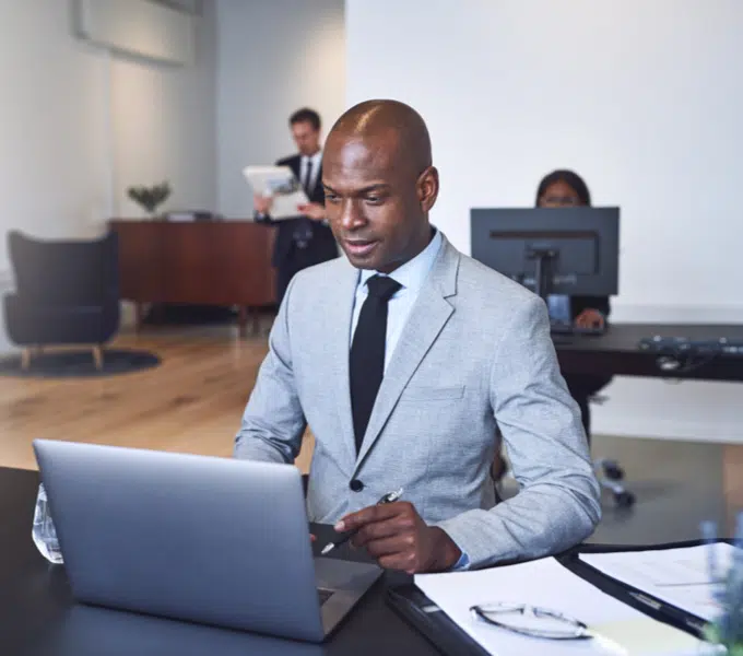 Professional working on a laptop in an office